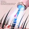 Close-up of hair strands being treated by a pink device emitting blue light, with text describing its benefits. Podgląd zdjęcia produktu