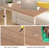 A collage of images showing a portable work table, a screwdriver, and water droplets being wiped off the table. Produktbild-Vorschau