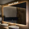 A modern bathroom with a large illuminated mirror above two sinks. Produktbild-Vorschau