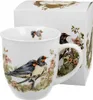 A white porcelain mug with a detailed illustration of two barn swallows perched on a branch with flowers, next to its packaging box. Anteprima dell’immagine prodotto