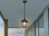 A black outdoor pendant light hangs from a chain on a porch ceiling. Produktbild-Vorschau