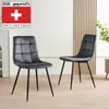 Two gray upholstered dining chairs with black metal legs are shown in a room with a light-colored wooden floor and a wall with vertical wooden slats. Produktbild-Vorschau