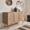 A wooden sideboard with rattan doors is shown in a room setting, decorated with vases and a wall basket. Anteprima dell’immagine prodotto