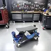 A workshop scene with tool storage cabinets and a rolling stool in the foreground. Produktbild-Vorschau