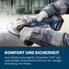 A person wearing work gloves is holding a cordless angle grinder, with sparks flying from the grinding disc. Náhľad obrázku produktu