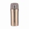 A gold colored thermos with a gray lid is shown against a white background. Anteprima dell’immagine prodotto