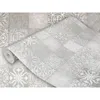 A roll of wallpaper with a tile-like pattern is partially unrolled, showing the design up close. Produktbild-Vorschau