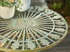 A close-up view of a decorative metal table with plants in pots on it. Náhled obrázku produktu