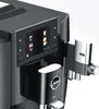 Close-up of a modern black superautomatic coffee machine with a digital display and chrome accents. Podgląd zdjęcia produktu