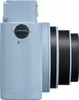 Side view of a light blue instant camera with a black lens. Anteprima dell’immagine prodotto