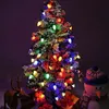 A decorated Christmas tree with colorful lights, a snowman figure, and a reindeer figure. Produktbild-Vorschau