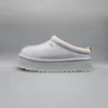 A single UGG Tazz slipper shown from the side against a plain gray background. Produktbild-Vorschau