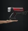 A hand holding a futuristic red and black device. Produktbild-Vorschau