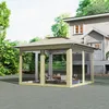 A khaki-colored gazebo with mosquito netting is set up on a paved area in front of a house, with trees and greenery in the background. Náhľad obrázku produktu