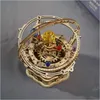 A wooden 3D puzzle model of a solar system or orrery. Voir les images du produit