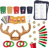 A collection of Christmas-themed party games and accessories laid out on a white background. Produktbild-Vorschau