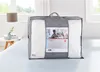 A comforter is shown in its packaging on a bed. Produktbild-Vorschau