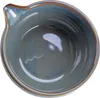 A top-down view of a ceramic bowl with a spout. Podgląd zdjęcia produktu