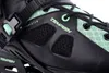 A close-up view of a black and green inline skate. Podgląd zdjęcia produktu