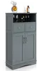 A gray bathroom cabinet with two doors and two drawers, displayed against a white background. Náhled obrázku produktu
