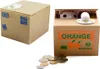 A collage of two coin banks, one a plain cardboard box and the other a "money eating" cat coin bank inside a cardboard box decorated with oranges. Náhľad obrázku produktu