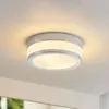 A ceiling light fixture mounted on a white ceiling. Produktbild-Vorschau