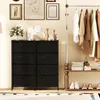 A room with a dresser, clothing rack, and artwork on the wall. Podgląd zdjęcia produktu