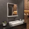 A modern bathroom with a sink, faucet, mirror, and wooden accents. Produktbild-Vorschau