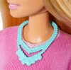 Close-up of a doll's neck and shoulders, showing a pink sweater and a blue necklace. Podgląd zdjęcia produktu