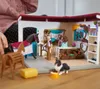 A child's hands are visible playing with a toy horse stable playset. Produktbild-Vorschau