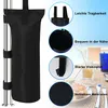 A black sandbag is attached to a metal pole, with close-up images and text highlighting its features, set against a background of a beach or poolside scene. Produktbild-Vorschau