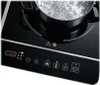 Close-up of an induction cooktop with a pot of boiling water. Náhľad obrázku produktu