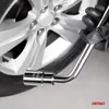 A gloved hand holding a lug wrench near a car wheel. Náhľad obrázku produktu