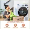 A woman is holding a green towel next to a washing machine and a laundry basket. Produktbild-Vorschau