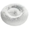 A fluffy, round dog bed with a raised edge, presented on a white background. Produktbild-Vorschau