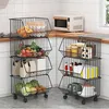 A kitchen scene with two multi-tiered wire storage trolleys filled with various food items and kitchenware. Anteprima dell’immagine prodotto