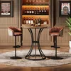 A bar area with a round table and two bar stools, set against a backdrop of wine bottles and glasses. Produktbild-Vorschau