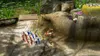 A group of small characters, likely from a video game, are gathered on a rocky, outdoor terrain. Produktbild-Vorschau