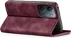 A burgundy flip case for a smartphone is shown from the side, with the phone inserted and the front cover folded open. Produktbild-Vorschau