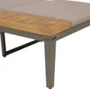 Close-up view of the corner of a sun lounger, showing the wooden armrest and metal legs. Produktbild-Vorschau
