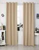 Two beige curtains hang in front of a window, with a white cabinet and a small table with decorative items visible on either side. Produktbild-Vorschau