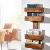 A wooden magazine rack mounted on a white wall, with chairs visible in the background. Produktbild-Vorschau