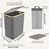 Diagrams and text illustrating the dimensions and features of a laundry basket. Produktbild-Vorschau