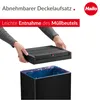 Hands are shown removing a black lid from a black trash can with a blue liner. Náhled obrázku produktu