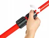 A hand is shown adjusting a black and red connector on a red pole. Náhled obrázku produktu
