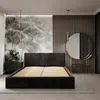 A bedroom scene with a bed, nightstand, and mirror. Podgląd zdjęcia produktu