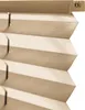 A close-up view of a beige pleated blind. Produktbild-Vorschau