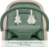 Close-up view of a green baby bouncer with hanging toys and a wooden frame. Produktbild-Vorschau