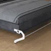 A close-up view of the bottom corner of a bed frame with a white support leg extended. Náhled obrázku produktu