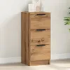A wooden sideboard with three drawers against a white wall. Anteprima dell’immagine prodotto